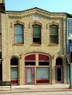 364 E MAIN ST, a Commercial Vernacular small retail building, built in Stoughton, Wisconsin in 1884.