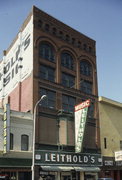 116 S 4TH ST, a Romanesque Revival retail building, built in La Crosse, Wisconsin in 1884.