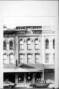 118 S 3RD ST, a Italianate small retail building, built in La Crosse, Wisconsin in 1874.