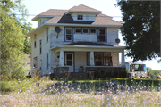 N202 U.S. HIGHWAY 12, a American Foursquare house, built in Koshkonong, Wisconsin in 1900.