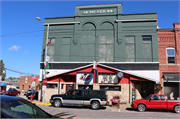 1544-1546 COMMERCIAL ST, a Romanesque Revival theater/opera house/concert hall, built in Bangor, Wisconsin in 1899.