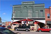 1544-1546 COMMERCIAL ST, a Romanesque Revival opera house/concert hall, built in Bangor, Wisconsin in 1899.