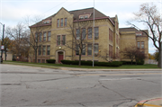 1130 Carlisle Ave., a Romanesque Revival elementary, middle, jr.high, or high, built in Racine, Wisconsin in 1890.