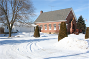 S913 STH 88, 0.13 MI N OF COUNTY HIGHWAY NN, a Romanesque Revival one to six room school, built in Gilmanton, Wisconsin in 1913.
