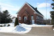 S913 STH 88, 0.13 MI N OF COUNTY HIGHWAY NN, a Romanesque Revival one to six room school, built in Gilmanton, Wisconsin in 1913.