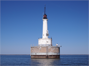 Offshore in lower Green Bay, 3.1 miles NW of Point Comfort, a Astylistic Utilitarian Building light house, built in Scott, Wisconsin in 1936.