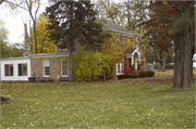 305 WISCONSIN AVE, a Colonial Revival/Georgian Revival house, built in Denmark, Wisconsin in 1930.