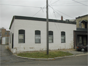 913-929 W EXCHANGE ST, a Early Gothic Revival large retail building, built in Brodhead, Wisconsin in 1869.