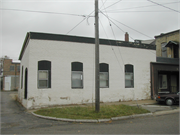 913-929 W EXCHANGE ST, a Early Gothic Revival retail building, built in Brodhead, Wisconsin in 1869.