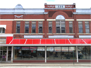 125 S WATER ST, a Romanesque Revival large retail building, built in Sparta, Wisconsin in 1896.