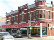 125 S WATER ST, a Romanesque Revival large retail building, built in Sparta, Wisconsin in 1896.