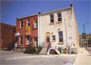 301 W MAIN AVE, a Commercial Vernacular small retail building, built in De Pere, Wisconsin in 1887.