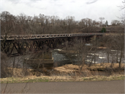 EAU CLAIRE RIVER, S OF FORMER UNIROYAL PLANT, a NA (unknown or not a building) bridge, built in Eau Claire, Wisconsin in 1910.