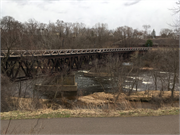 EAU CLAIRE RIVER, S OF FORMER UNIROYAL PLANT, a NA (unknown or not a building) deck truss bridge, built in Eau Claire, Wisconsin in 1910.