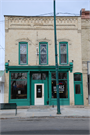 135 N MAIN ST, a Commercial Vernacular retail building, built in Lake Mills, Wisconsin in 1876.