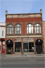 103-105 S MAIN ST, a Romanesque Revival retail building, built in Lake Mills, Wisconsin in 1895.