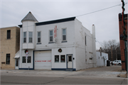 119 S MAIN ST, a Commercial Vernacular livery/stable, built in Lake Mills, Wisconsin in 1891.