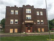 710 11TH ST E, a Late Gothic Revival elementary, middle, jr.high, or high, built in Menomonie, Wisconsin in 1925.