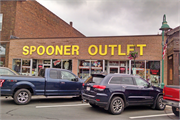 209 WALNUT ST, a Commercial Vernacular large retail building, built in Spooner, Wisconsin in 1910.