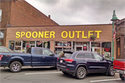 209 WALNUT ST, a Commercial Vernacular retail building, built in Spooner, Wisconsin in 1910.