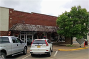 243 WALNUT ST, a Commercial Vernacular large retail building, built in Spooner, Wisconsin in 1920.