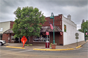 243 WALNUT ST, a Commercial Vernacular large retail building, built in Spooner, Wisconsin in 1920.