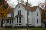 320 13TH AVE W, a Gabled Ell house, built in Menomonie, Wisconsin in 1895.