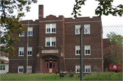 710 11TH ST E, a Late Gothic Revival elementary, middle, jr.high, or high, built in Menomonie, Wisconsin in 1925.