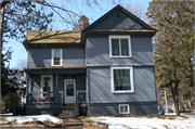 114 S 5TH AVE, a Gabled Ell house, built in Wausau, Wisconsin in 1900.