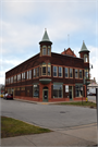 1821 HALL AVE, a Queen Anne large retail building, built in Marinette, Wisconsin in 1890.