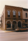 114 E Blackhawk Ave, a Romanesque Revival retail building, built in Prairie du Chien, Wisconsin in 1881.