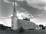 ON BUSS ROAD, ONE BLOCK S OF SHOPIERE RD, a Greek Revival house of worship, built in Turtle, Wisconsin in 1850.