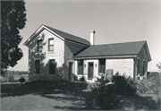 76 US Highway 14, a Gabled Ell house, built in Rutland, Wisconsin in 1850.