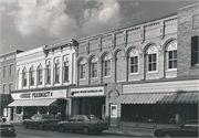 208-210 E MAIN ST, a Romanesque Revival large retail building, built in Watertown, Wisconsin in 1864.