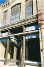 132-140 W JAMES ST, a Commercial Vernacular small retail building, built in Columbus, Wisconsin in 1850.