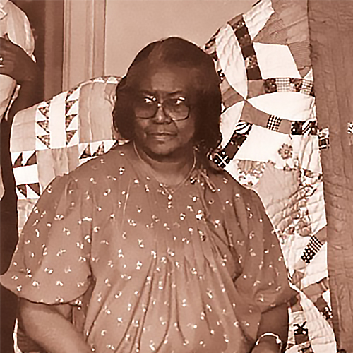 Allie Crumble working on a quilt, 1987. Throwing some serious side eye.