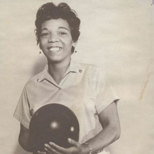 Earlene Fuller, smiles happily while holding her bowling ball. From the collection of Earlene Fuller bowling league photographs, 1963-1995.