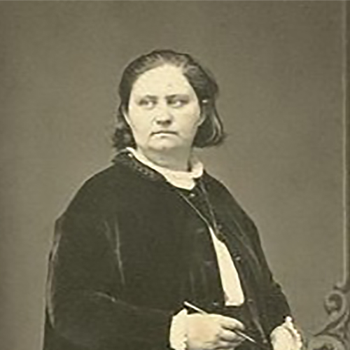 An austere woman stands facing to the right, but looking left. She holds writing implements and wears a long black robe.