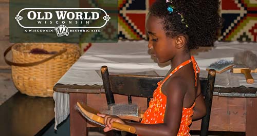 Children playing at wool carding at Old World Wisconsin.