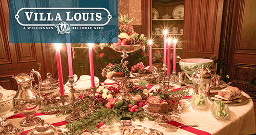 Villa Louis. A candle lit dining table display for Christmas and Home for the Holidays experience.