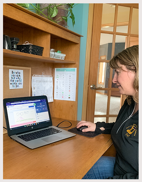 Windsor Elementary kindergarten teacher Carey Eiselt working on a virtual learning assignment for her students during the COVID-19 Pandemic