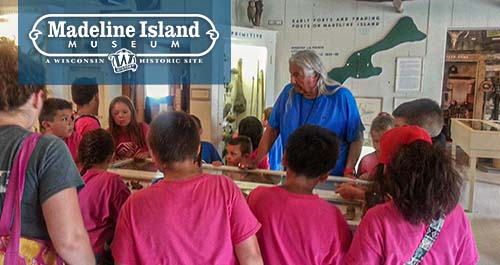 Children exploring exhibit on the Madeline Island Museum.