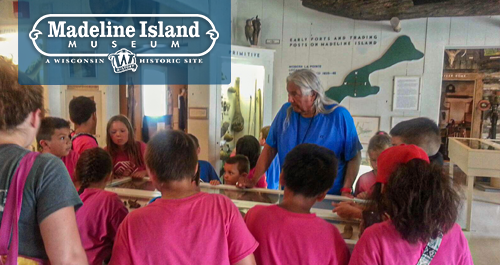 Children exploring exhibit on the Madeline Island Museum.