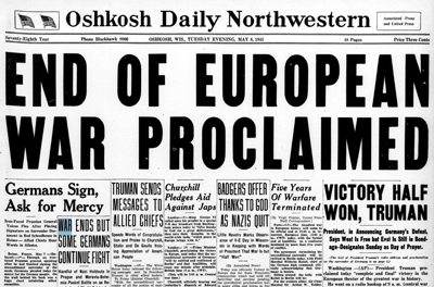 Page one of the Oshkosh Daily Northwestern newspaper. Headline reads 'End of European War Proclaimed.'
