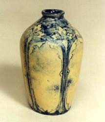Art pottery bud vase, earthenware, yellow, blue iris design.