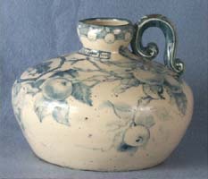 Art pottery cider jug, jug, stoneware, squat ball shape, blue apple branch design, handle
