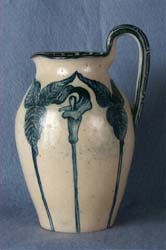 Art pottery pitcher, stoneware, blue jack-in-the-pulpit design.